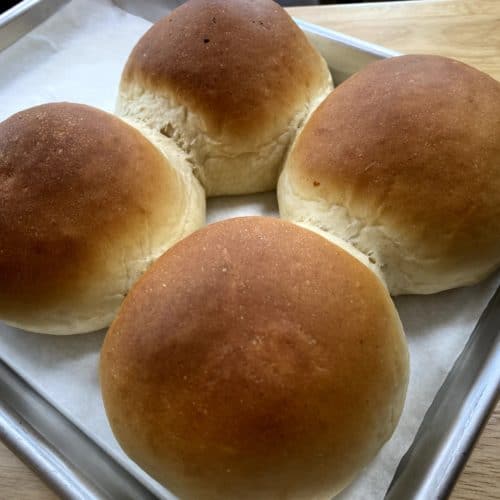 4 cheese zombie rolls on a baking sheet, freshly baked