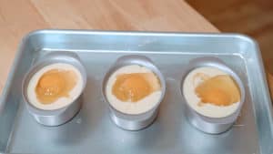 Raw eggs floating in batter.