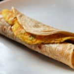 A Ugandan Rolex on a white plate.