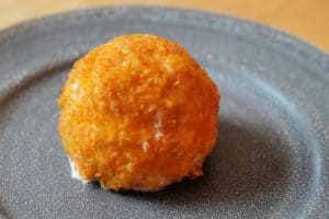 A golden ball of fried ice cream.