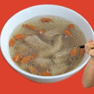 A clear broth with goji berries and ox penis.