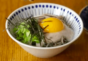 raw egg, nori, and nagaimo on cold soba in a bowl
