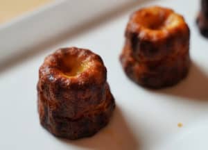 Canele on a white plate.