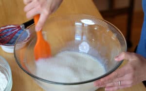 Mixing wet ingredients in a bowl.