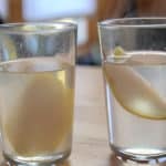 Slices of pear in a glass and clear jelly.