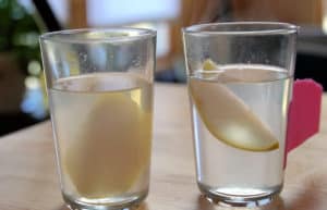 Slices of pear in a glass and clear jelly.