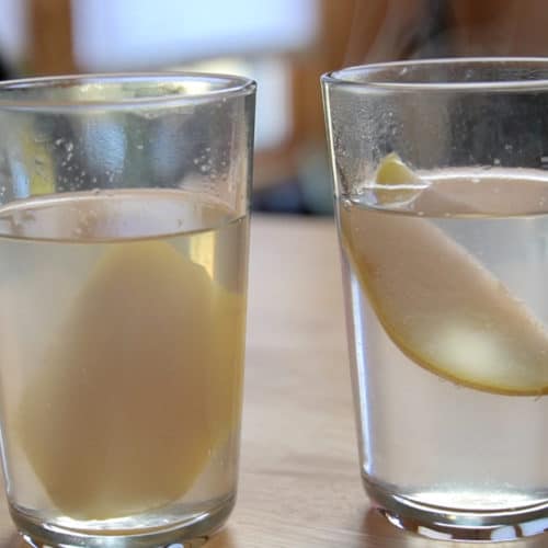 Slices of pear in a glass and clear jelly.