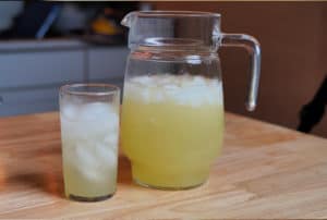 Pitcher of lemonade with a glass