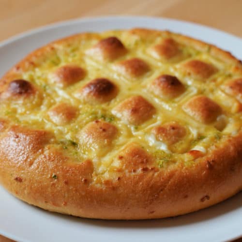 A golden brown pull a part Korean garlic cheese bread.