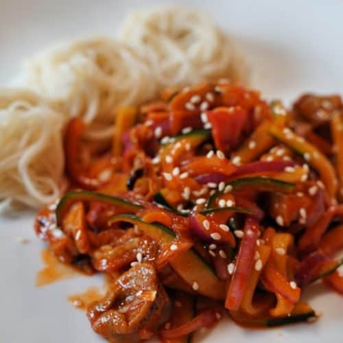 Three coils of somen noodles with sea snail salad.