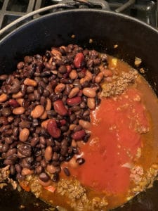 Beans, tomato sauce, and coffee in the chili pot.