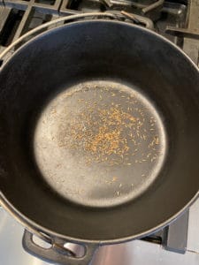 toasting cumin seeds in cast iron pot