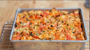 Square baking pan filled with baked sushi.