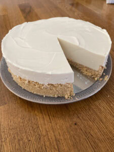 Cremora tart with slice removed. Looks like no-bake cheesecake.